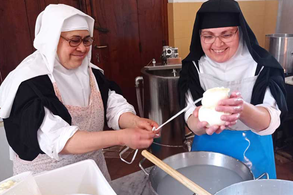 Two nuns working with the Dairy Polyvalent at the Visitation Monastery
